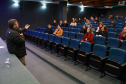 auditório com agentes de compliance