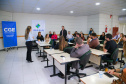 fotos do curso de integração em que aparecem os novos servidores e apresentações feitas por coordenadores e chefes de núcleos.