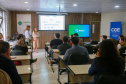 fotos do curso de integração em que aparecem os novos servidores e apresentações feitas por coordenadores e chefes de núcleos.