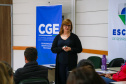 fotos do curso de integração em que aparecem os novos servidores e apresentações feitas por coordenadores e chefes de núcleos.