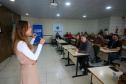 fotos do curso de integração em que aparecem os novos servidores e apresentações feitas por coordenadores e chefes de núcleos.