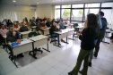 fotos do curso de integração em que aparecem os novos servidores e apresentações feitas por coordenadores e chefes de núcleos.