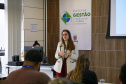 fotos do curso de integração em que aparecem os novos servidores e apresentações feitas por coordenadores e chefes de núcleos.