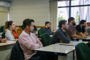 fotos do curso de integração em que aparecem os novos servidores e apresentações feitas por coordenadores e chefes de núcleos.
