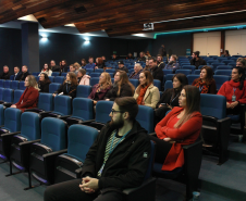 auditório com agentes de compliance